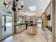 Spacious kitchen featuring a center island, black countertops, and custom cabinetry at 2605 Nevada Rd, Lakeland, FL 33803