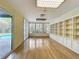 The flexible living space includes built-ins, and large windows overlooking the pool and backyard at 2605 Nevada Rd, Lakeland, FL 33803