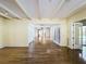 A wide-open living space with hardwood floors, abundant natural light, and easy access to the pool at 2605 Nevada Rd, Lakeland, FL 33803