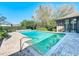 Inviting in-ground pool featuring turquoise water and surrounded by a brick-paved patio, perfect for relaxing at 2605 Nevada Rd, Lakeland, FL 33803