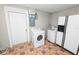 Functional laundry area equipped with a washer, dryer, and a refrigerator at 2735 Aldine Cir, Lakeland, FL 33801