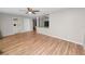 Spacious living room with laminate flooring and an open layout connecting to the kitchen at 2735 Aldine Cir, Lakeland, FL 33801