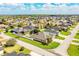 Located in a lush planned community, this home features a manicured lawn and mature palm trees at 2814 Sheldon St, Lakeland, FL 33813