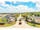 Aerial view of gated community entrance with manicured landscaping and tree-lined streets at 2814 Sheldon St, Lakeland, FL 33813
