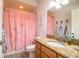 Bathroom featuring a shower with a floral curtain and granite countertops at 2814 Sheldon St, Lakeland, FL 33813