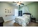 Cozy bedroom with floral bedding and ceiling fan at 2814 Sheldon St, Lakeland, FL 33813