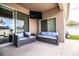 Inviting covered patio with comfortable seating, a ceiling fan, and a mounted TV at 2814 Sheldon St, Lakeland, FL 33813