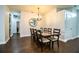 Spacious dining room featuring dark hardwood floors and elegant chandelier at 2814 Sheldon St, Lakeland, FL 33813