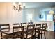 Chandelier lit Dining room with dark wood table and views to other rooms at 2814 Sheldon St, Lakeland, FL 33813