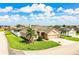 A manicured lawn and mature palms surround this attractive house with a three-car garage and stone facade at 2814 Sheldon St, Lakeland, FL 33813