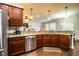 Spacious kitchen features stainless steel appliances, granite countertops, and wood floors at 2814 Sheldon St, Lakeland, FL 33813