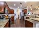 Spacious kitchen featuring stainless steel appliances, granite countertops, and wood cabinets for a modern design at 2814 Sheldon St, Lakeland, FL 33813