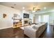Inviting living room featuring hardwood floors, a modern fireplace, built-in shelving, and a comfortable couch at 2814 Sheldon St, Lakeland, FL 33813