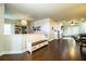 Open-concept living room with hardwood floors, built-in shelving, and modern light fixture at 2814 Sheldon St, Lakeland, FL 33813