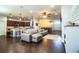 Open-concept living room featuring hardwood floors, contemporary furniture, and seamless flow to kitchen and dining areas at 2814 Sheldon St, Lakeland, FL 33813