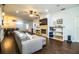 Spacious living room with a fireplace, modern furnishings, and wood floors at 2814 Sheldon St, Lakeland, FL 33813