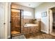 Main bathroom with tiled shower, soaking tub, and private toilet area at 2814 Sheldon St, Lakeland, FL 33813