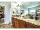 Main bathroom with granite countertop vanity with double sinks and tiled floors at 2814 Sheldon St, Lakeland, FL 33813