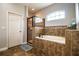 Main bathroom with tiled shower, soaking tub, and private toilet area at 2814 Sheldon St, Lakeland, FL 33813