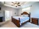 Main bedroom features tray ceiling, carpet, and decorative furniture at 2814 Sheldon St, Lakeland, FL 33813