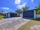 Driveway with large garage doors at 2821 Grapefruit Dr, Auburndale, FL 33823