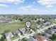 Aerial view of the property in a residential neighborhood; a pointer identifies the location at 300 Keswick Ave, Davenport, FL 33897