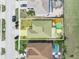 Aerial view of the property highlighting the home's footprint, yard, and outdoor living area with pool at 300 Keswick Ave, Davenport, FL 33897