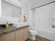 Bright bathroom featuring granite counters, modern sink, updated fixtures, and a shower/tub combo at 300 Keswick Ave, Davenport, FL 33897