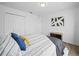 Cozy bedroom with neutral tones, comfortable bedding, and ample closet space at 300 Keswick Ave, Davenport, FL 33897