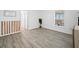 Bright bedroom with wood-look flooring, a large window, and a neutral color palette at 300 Keswick Ave, Davenport, FL 33897
