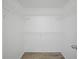 Walk-in closet with ample shelving for organized storage of clothing and accessories at 300 Keswick Ave, Davenport, FL 33897