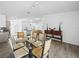 Open dining area featuring a glass table and seating for six at 300 Keswick Ave, Davenport, FL 33897