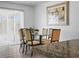 Dining room highlighting glass table, seating and decor at 300 Keswick Ave, Davenport, FL 33897