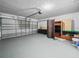 Spacious two-car garage with ample storage space and an automatic door opener at 300 Keswick Ave, Davenport, FL 33897
