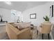 Inviting living room featuring neutral tones, archways, and wood-look flooring at 300 Keswick Ave, Davenport, FL 33897