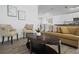 Living area featuring chairs, accent pillows, table, and decorative artwork at 300 Keswick Ave, Davenport, FL 33897