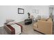Comfortable living room with stylish furnishings, wood-look floors, and neutral decor at 300 Keswick Ave, Davenport, FL 33897
