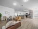 Open-concept living space connects the living room to the kitchen and dining area at 300 Keswick Ave, Davenport, FL 33897