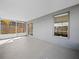 Enclosed lanai with neutral walls and flooring, leading to sliding glass doors at 300 Keswick Ave, Davenport, FL 33897