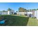 Spacious backyard with a shed, swing set, and room for entertaining at 301 St Georges Cir, Eagle Lake, FL 33839