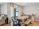 Cozy dining room featuring a modern wooden table, hardwood floors, and large sliding glass doors at 301 St Georges Cir, Eagle Lake, FL 33839