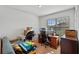 Office area featuring a desk, multiple monitors, and natural light at 301 St Georges Cir, Eagle Lake, FL 33839