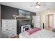 This bedroom features a TV, ceiling fan, and a closet at 301 St Georges Cir, Eagle Lake, FL 33839