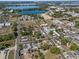 Aerial view of the community, showcasing the lake, neighborhood, and surrounding landscape at 302 Ave P Nw, Winter Haven, FL 33881