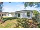 Backyard with lawn with newly painted house at 302 Ave P Nw, Winter Haven, FL 33881
