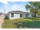 Back yard view with fresh lawn and siding at 302 Ave P Nw, Winter Haven, FL 33881