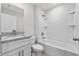 Clean bathroom with granite countertops and a shower-tub combination at 302 Ave P Nw, Winter Haven, FL 33881