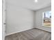 Cozy bedroom with neutral carpet and a window overlooking the neighborhood at 302 Ave P Nw, Winter Haven, FL 33881