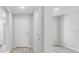 Bright entryway featuring laminate flooring and a neutral color palette at 302 Ave P Nw, Winter Haven, FL 33881