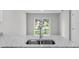 Bright kitchen featuring a granite countertop and double sink at 302 Ave P Nw, Winter Haven, FL 33881